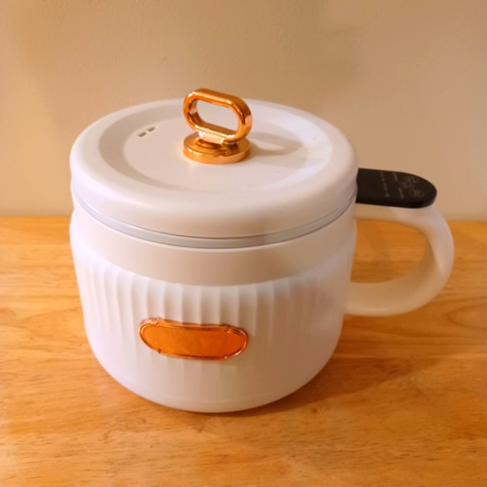 NutriChef 1.6L Multi- Functional Electrc Rice Cooker.